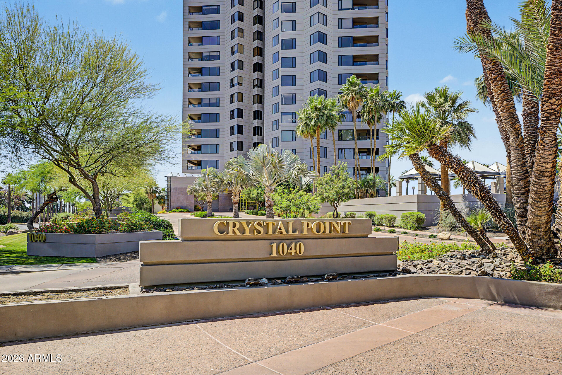 1040 East Osborn Road, Unit 402 Phoenix, AZ 85014 - Photo 2 of 96 a view of a sign board with flower plants