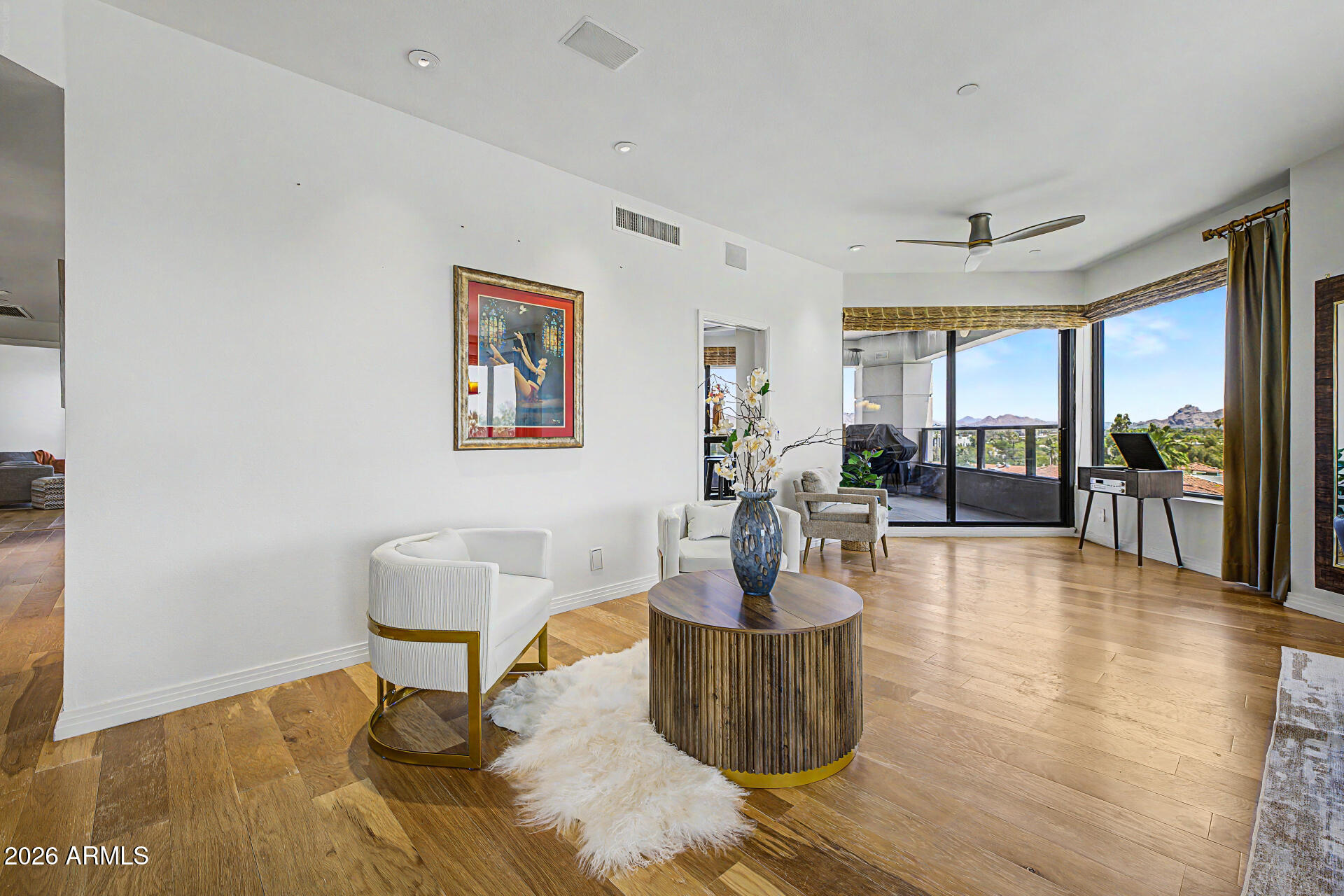 1040 East Osborn Road, Unit 402 Phoenix, AZ 85014 - Photo 25 of 96 a view of a dining room with furniture wooden floor and a potted plant