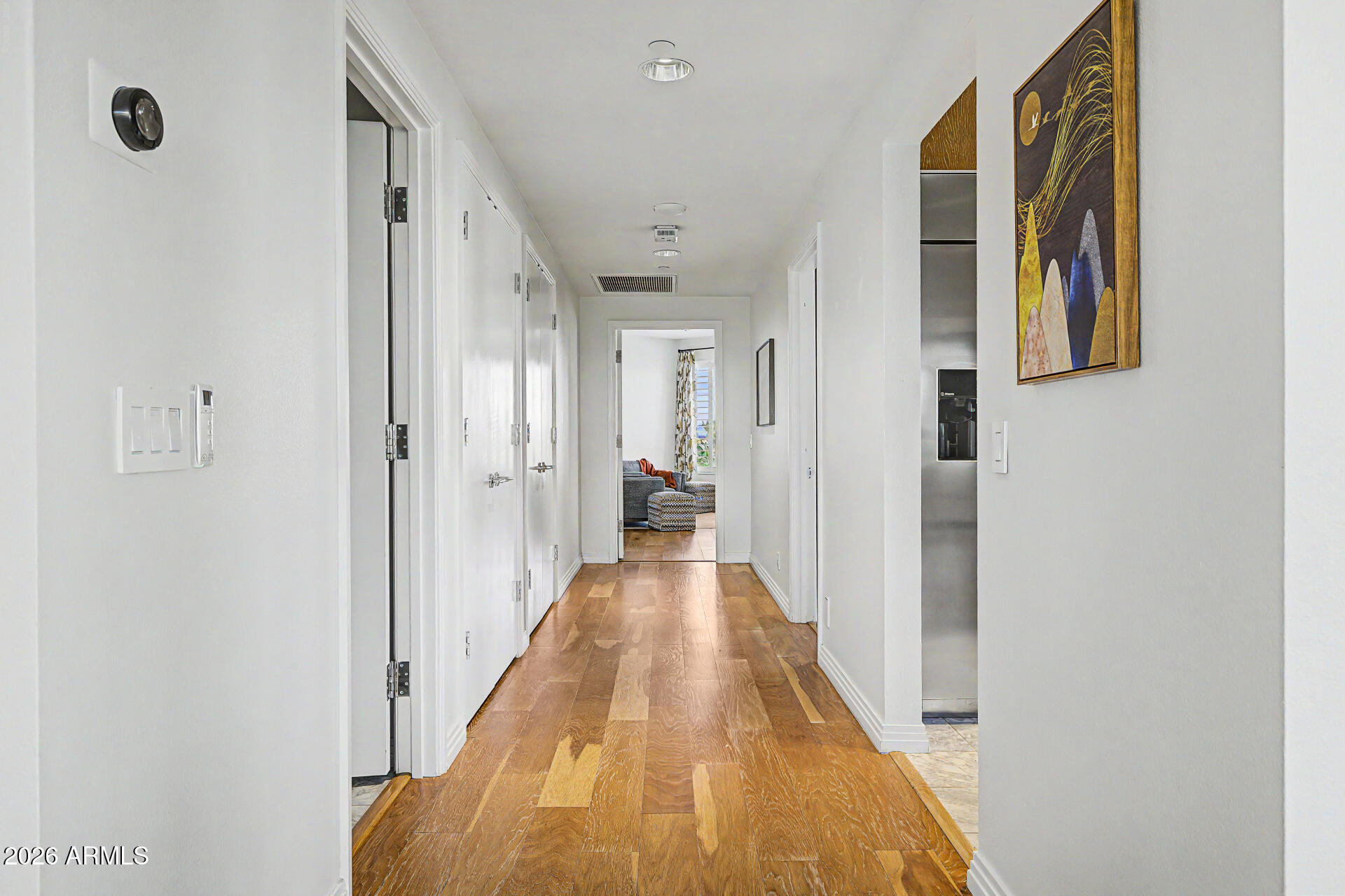 1040 East Osborn Road, Unit 402 Phoenix, AZ 85014 - Photo 29 of 96 a view of a hallway with wooden floor and staircase