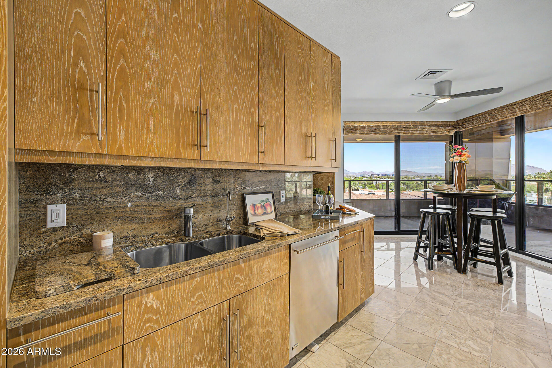 1040 East Osborn Road, Unit 402 Phoenix, AZ 85014 - Photo 32 of 96 a kitchen with stainless steel appliances granite countertop a stove a sink a dining table and chairs