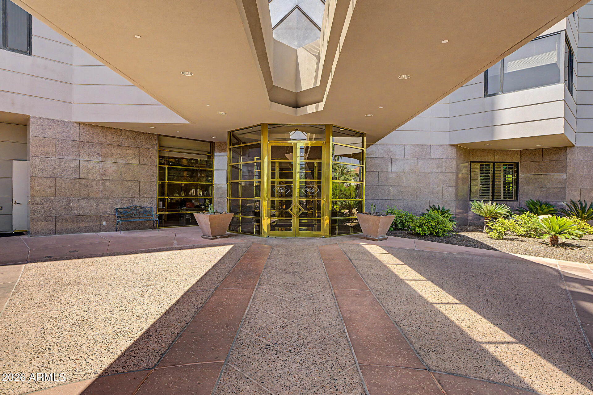 1040 East Osborn Road, Unit 402 Phoenix, AZ 85014 - Photo 5 of 96 a front view of a building with a garden