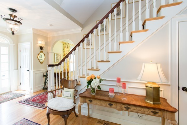 27 Amherst Road Wellesley, MA 02482 - Photo 3 of 20 a dining room with wooden floor and stairs