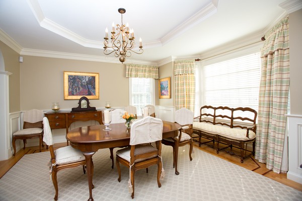 27 Amherst Road Wellesley, MA 02482 - Photo 5 of 20 a view of a dining room with furniture and a chandelier