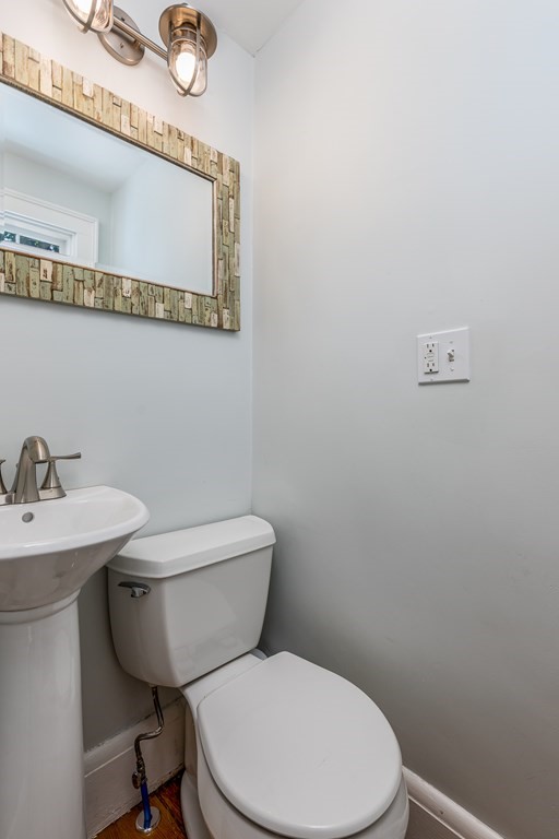 8 Pickwick Road Marblehead, MA 01945 - Photo 19 of 35 a white toilet sitting next to a bathroom sink