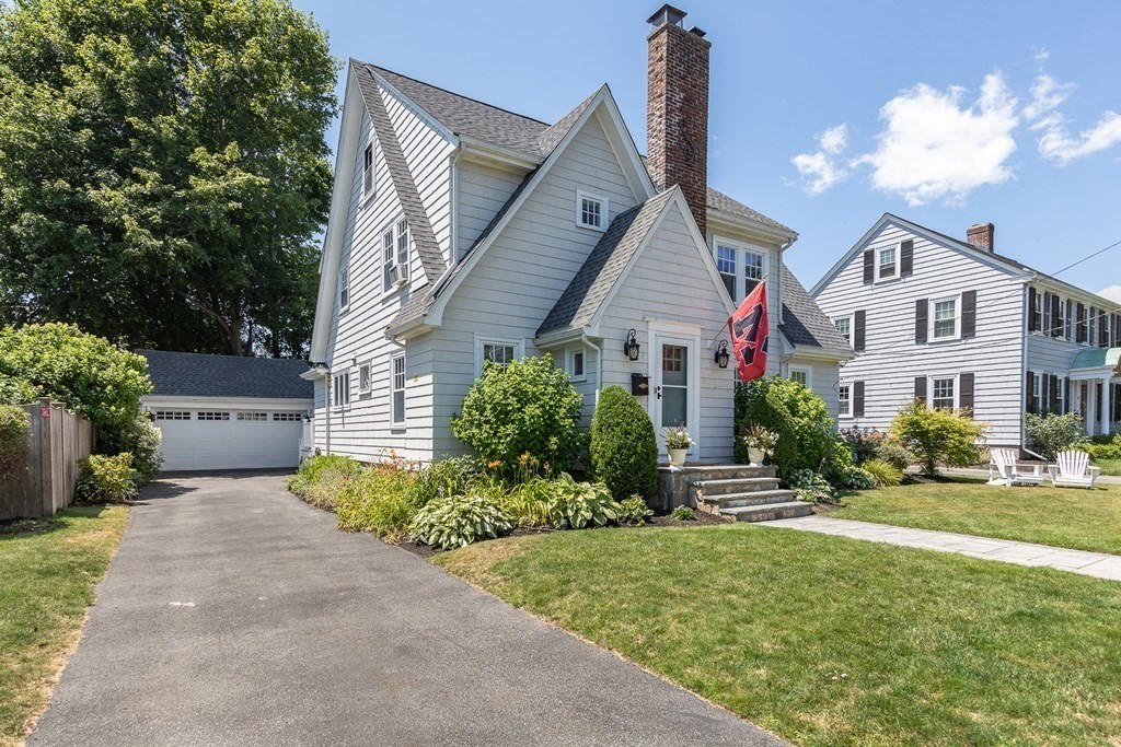 8 Pickwick Road Marblehead, MA 01945 - Photo 2 of 35 a front view of a house with a yard and potted plants