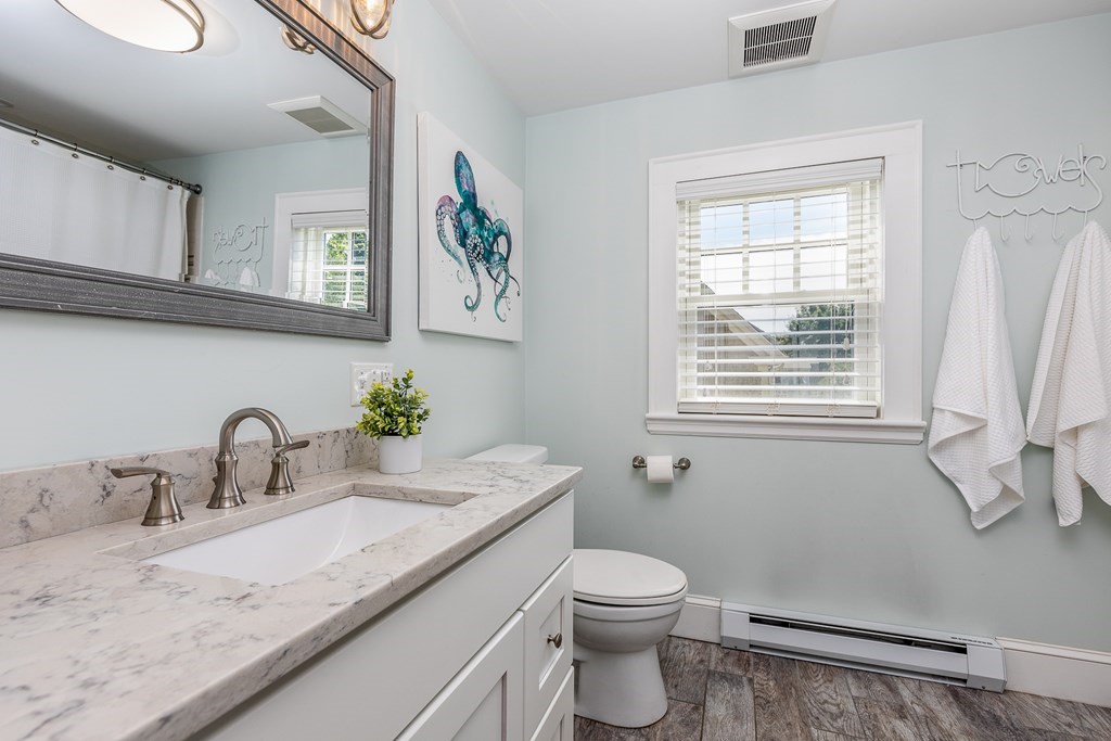8 Pickwick Road Marblehead, MA 01945 - Photo 21 of 35 a bathroom with a granite countertop toilet sink and mirror