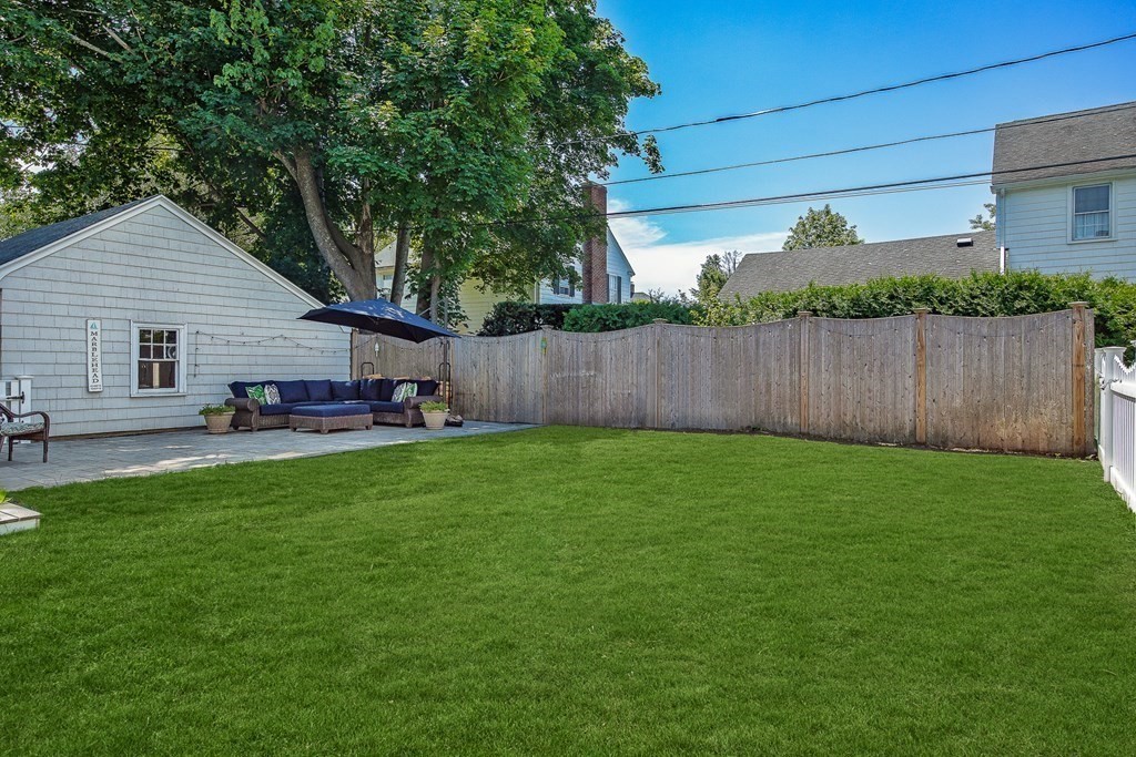 8 Pickwick Road Marblehead, MA 01945 - Photo 34 of 35 a backyard of a house with table and chairs