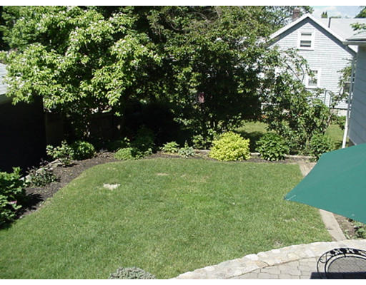 66 Robbins Road Watertown, MA 02472 - Photo 15 of 16 a view of a garden with a bench
