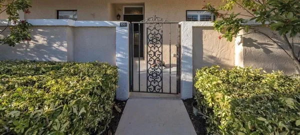 a view of a pathway house with plants