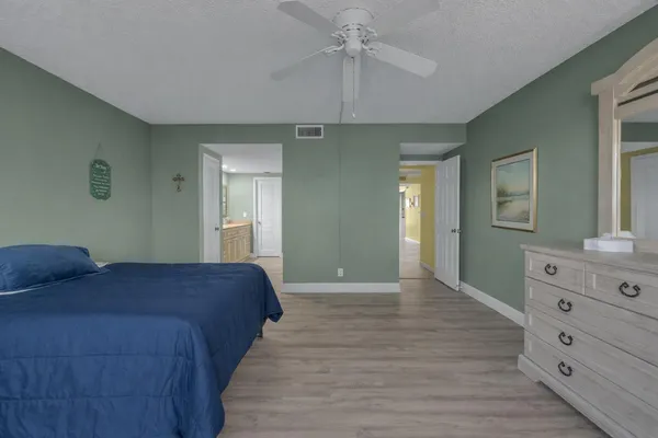 a bedroom with a bed and a dresser