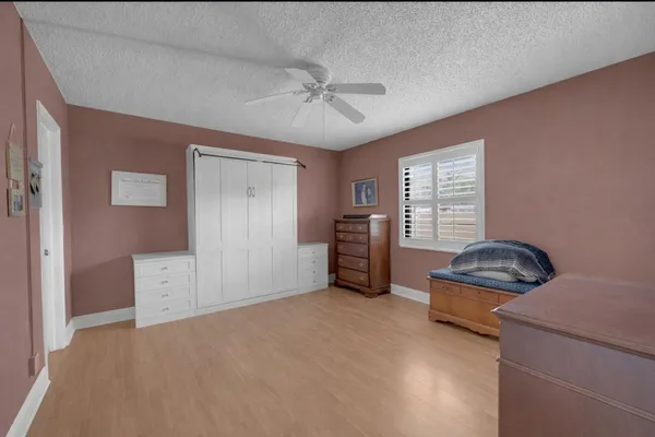 a bedroom with furniture and window