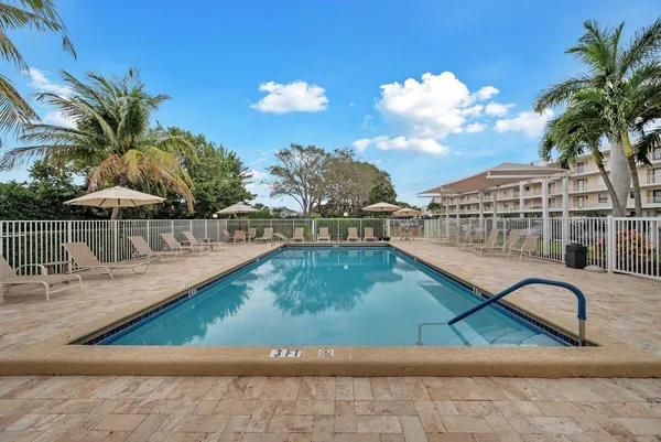 a view of a swimming pool with a lounge chairs