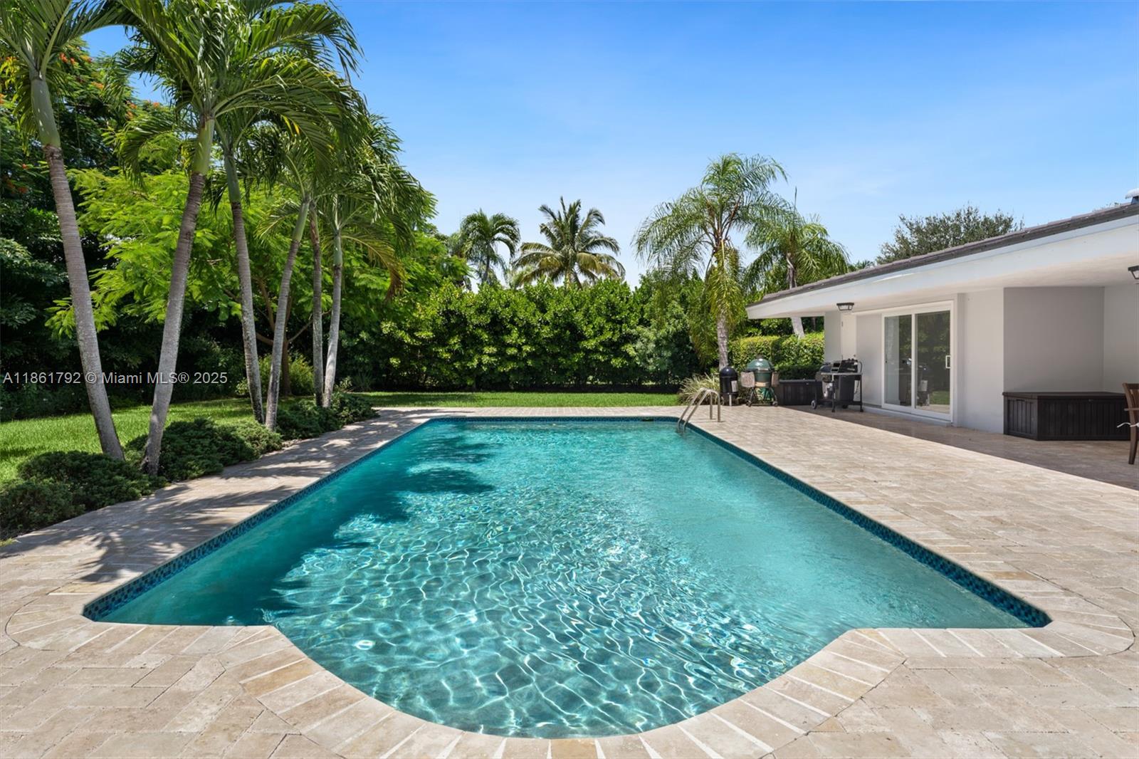 5940 Southwest 120th Street Pinecrest, FL 33156 - Photo 27 of 40 a view of a backyard with swimming pool