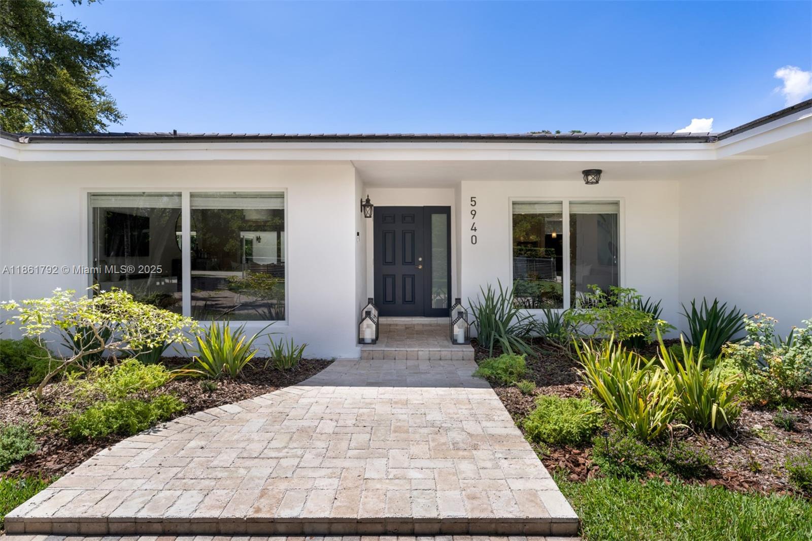5940 Southwest 120th Street Pinecrest, FL 33156 - Photo 3 of 40 a entryway view with a garden