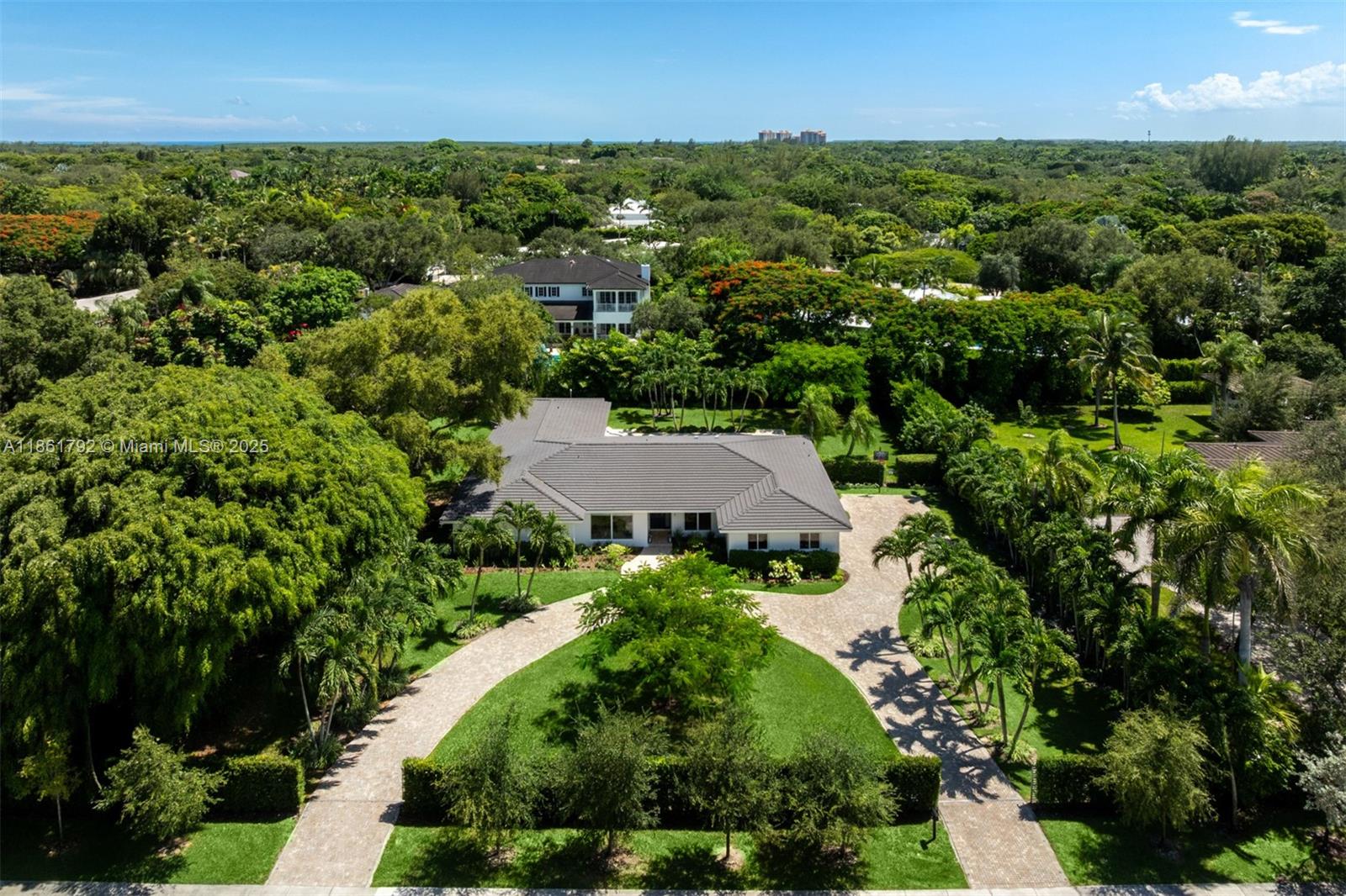 5940 Southwest 120th Street Pinecrest, FL 33156 - Photo 36 of 40 an aerial view of residential houses with outdoor space and trees