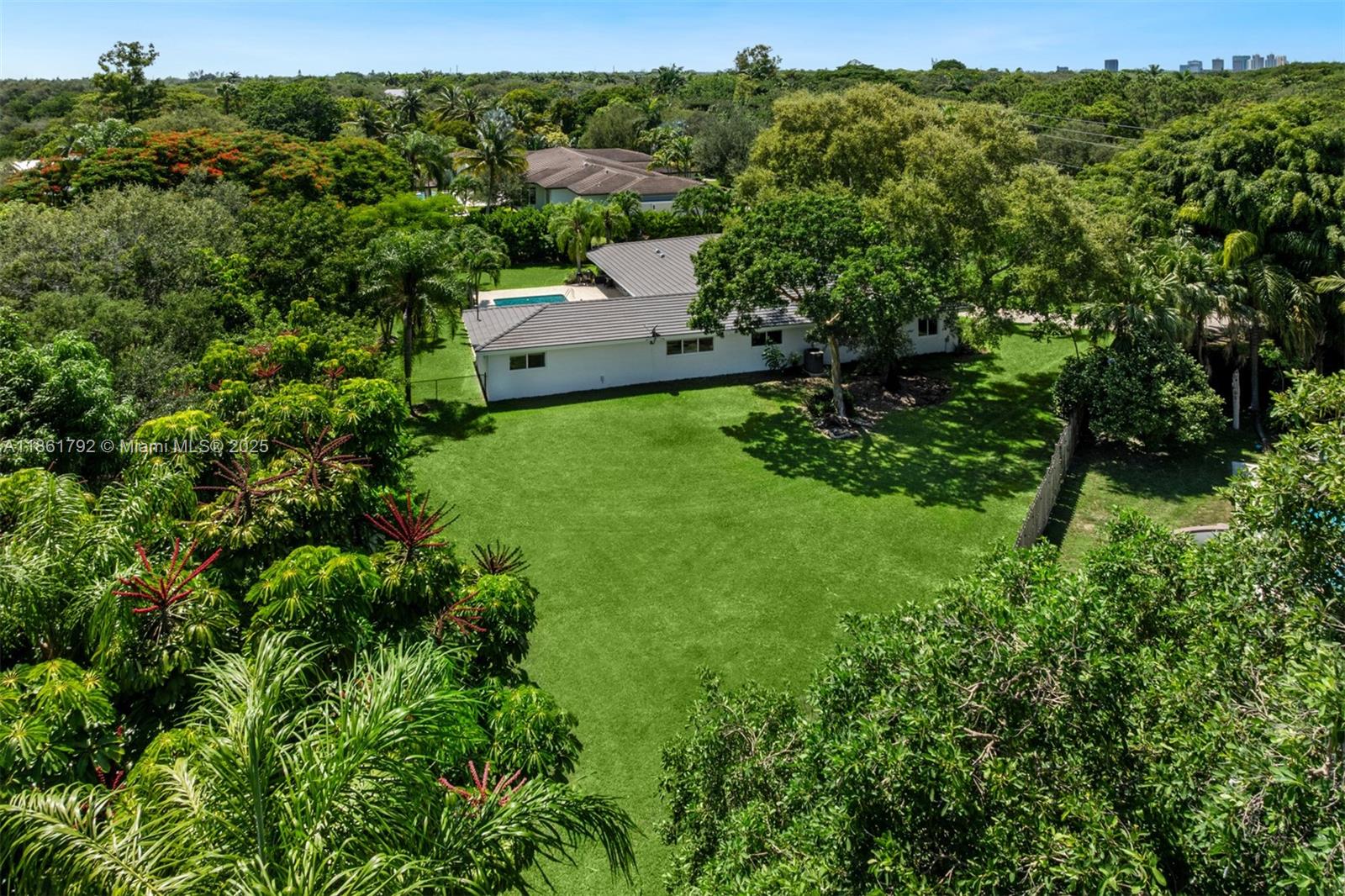 5940 Southwest 120th Street Pinecrest, FL 33156 - Photo 37 of 40 an aerial view of a house with yard