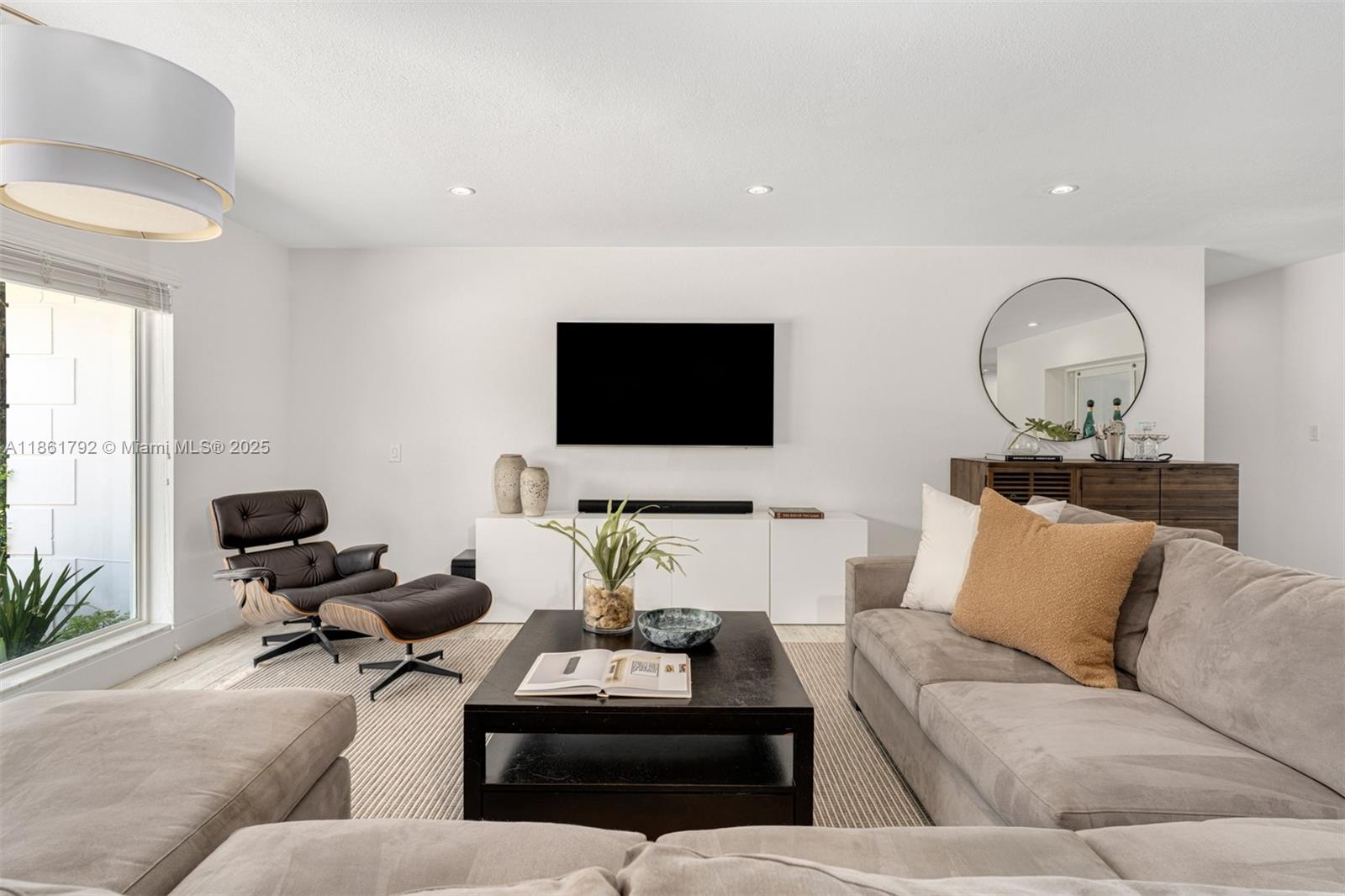 5940 Southwest 120th Street Pinecrest, FL 33156 - Photo 5 of 40 a living room with furniture and a flat screen tv