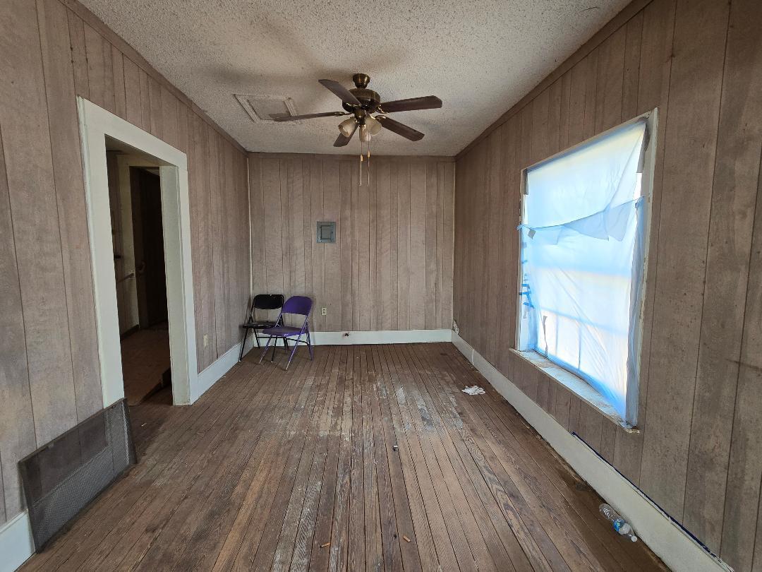 1506 North 1st Street Lamesa, TX 79331 - Photo 2 of 10 a view of a livingroom with furniture and hardwood floor