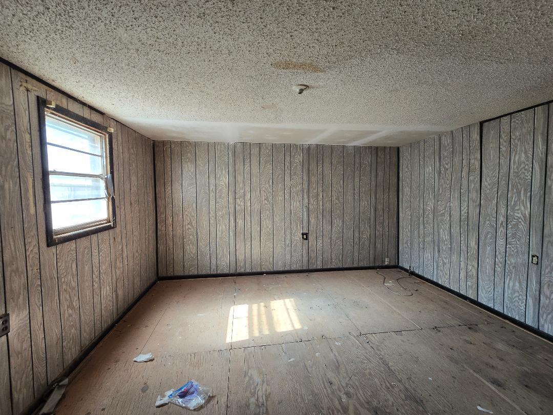 1506 North 1st Street Lamesa, TX 79331 - Photo 3 of 10 a view of an empty room with a window