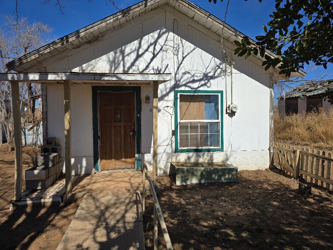 1506 North 1st Street Lamesa, TX 79331 - Photo 9 of 10 a view of a house with a large window and potted plants