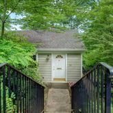 a view of house with trees in the background