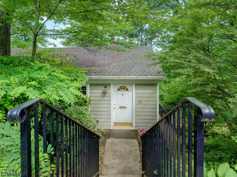 a view of house with trees in the background