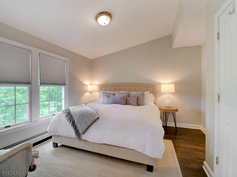33 Cliffside Trail Denville, NJ 07834 - Photo 14 of 25 a bedroom with a bed and a large window