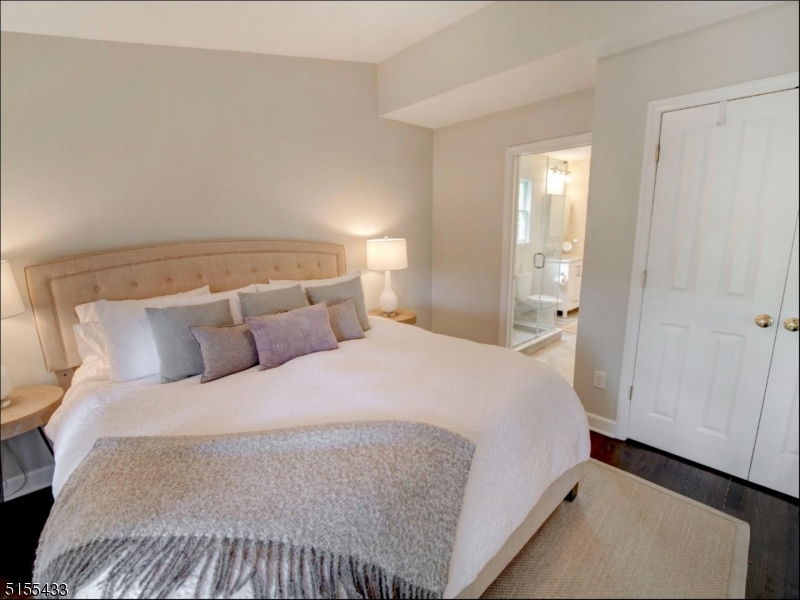 33 Cliffside Trail Denville, NJ 07834 - Photo 15 of 25 a bedroom with a bed and a mirror