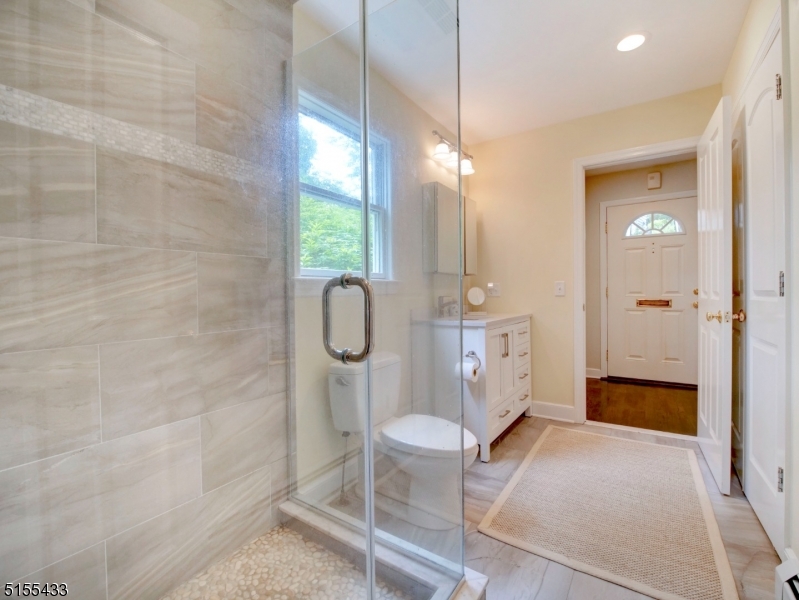 33 Cliffside Trail Denville, NJ 07834 - Photo 17 of 25 a spacious bathroom with a granite countertop sink a toilet and shower