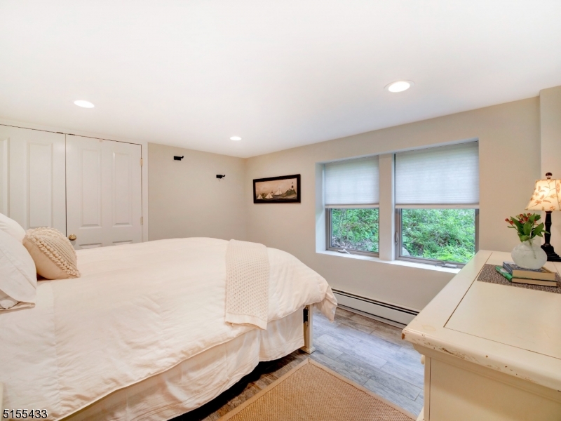 33 Cliffside Trail Denville, NJ 07834 - Photo 18 of 25 a bed sitting in a spacious bedroom next to a window