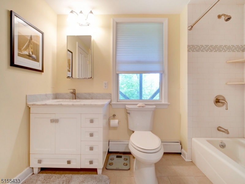 33 Cliffside Trail Denville, NJ 07834 - Photo 19 of 25 a bathroom with a toilet sink and mirror