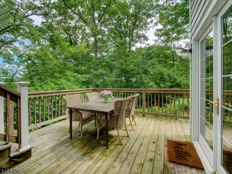 33 Cliffside Trail Denville, NJ 07834 - Photo 23 of 25 a balcony with wooden floor table and chairs