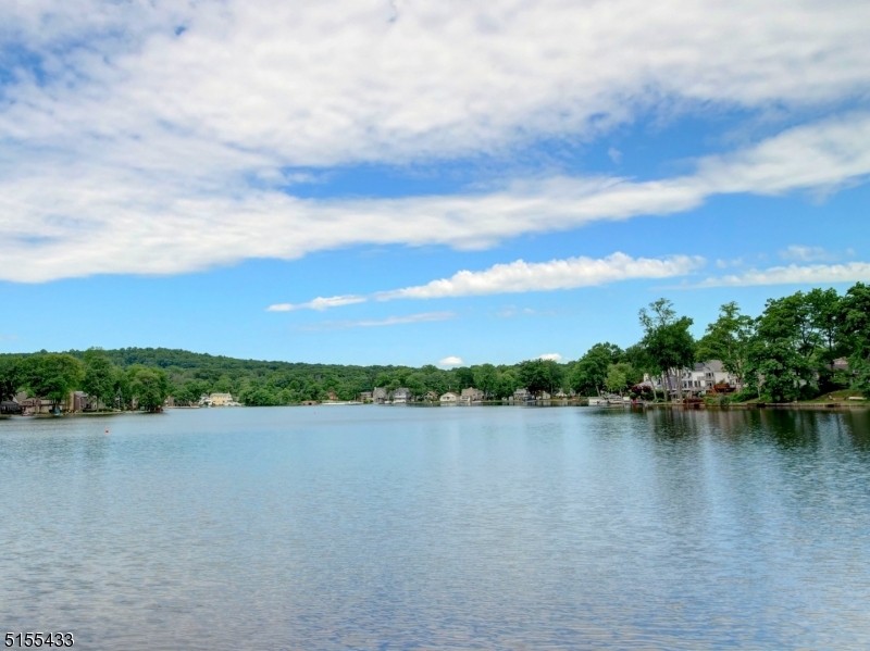 33 Cliffside Trail Denville, NJ 07834 - Photo 25 of 25 a view of a lake with houses in the back
