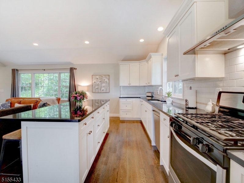 33 Cliffside Trail Denville, NJ 07834 - Photo 6 of 25 a large kitchen with stainless steel appliances granite countertop a stove and a large window