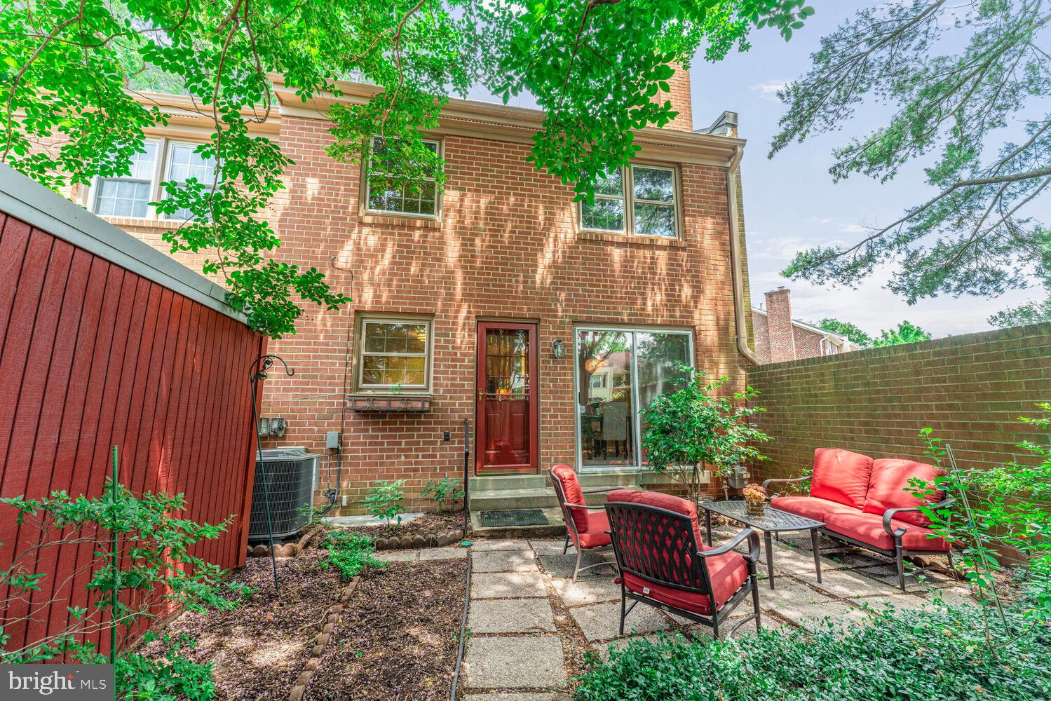 5932 Queenston Street Springfield, VA 22152 - Photo 11 of 47 a view of a chairs and table in the backyard