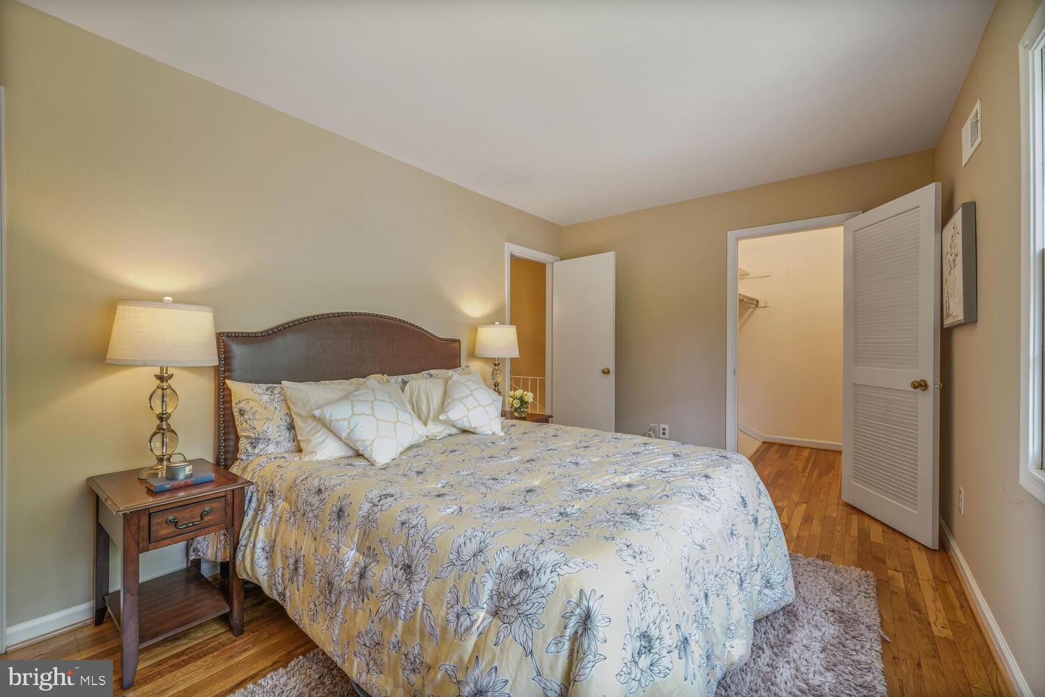 5932 Queenston Street Springfield, VA 22152 - Photo 18 of 47 a bedroom with a bed and a lamp