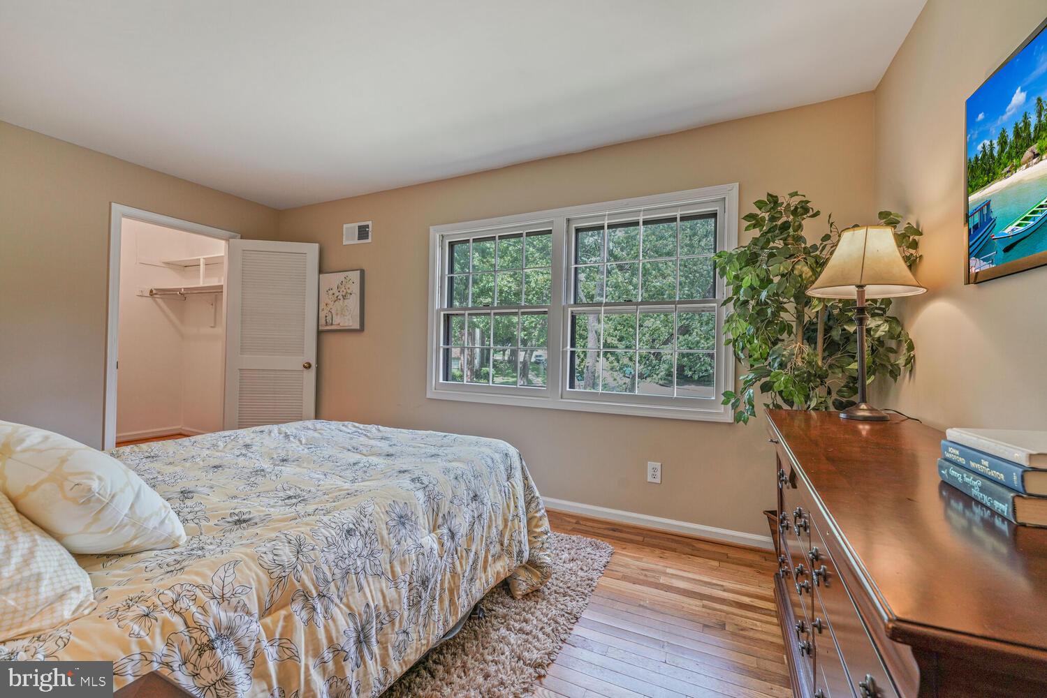 5932 Queenston Street Springfield, VA 22152 - Photo 20 of 47 a bedroom with a bed window and a table