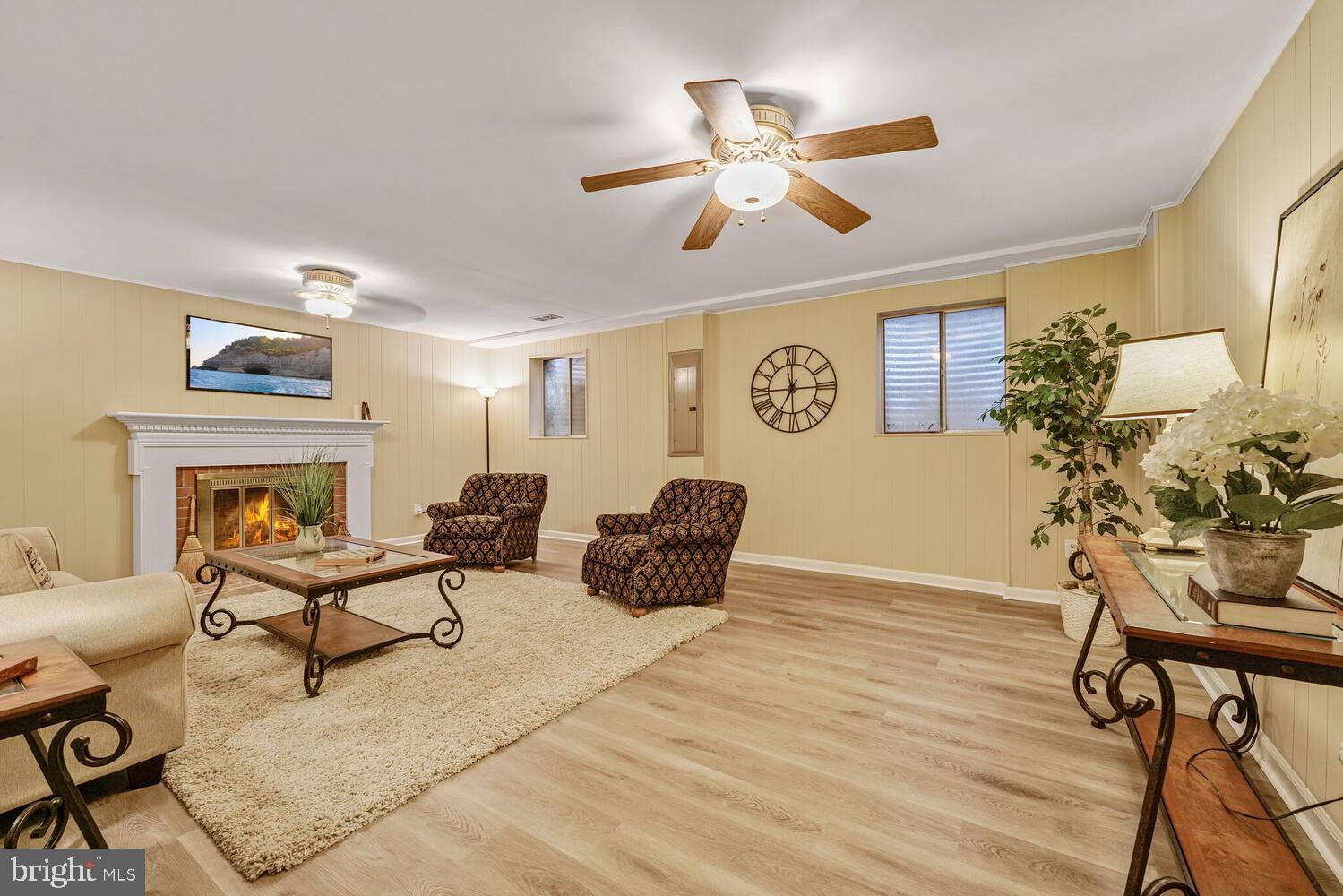 5932 Queenston Street Springfield, VA 22152 - Photo 26 of 47 a living room with furniture and a chandelier