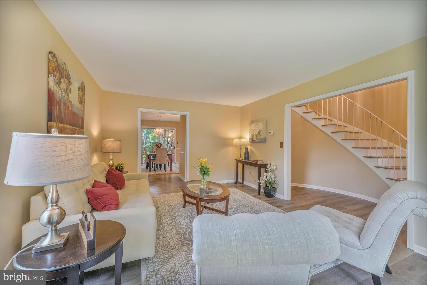 5932 Queenston Street Springfield, VA 22152 - Photo 3 of 47 a living room with furniture and a lamp