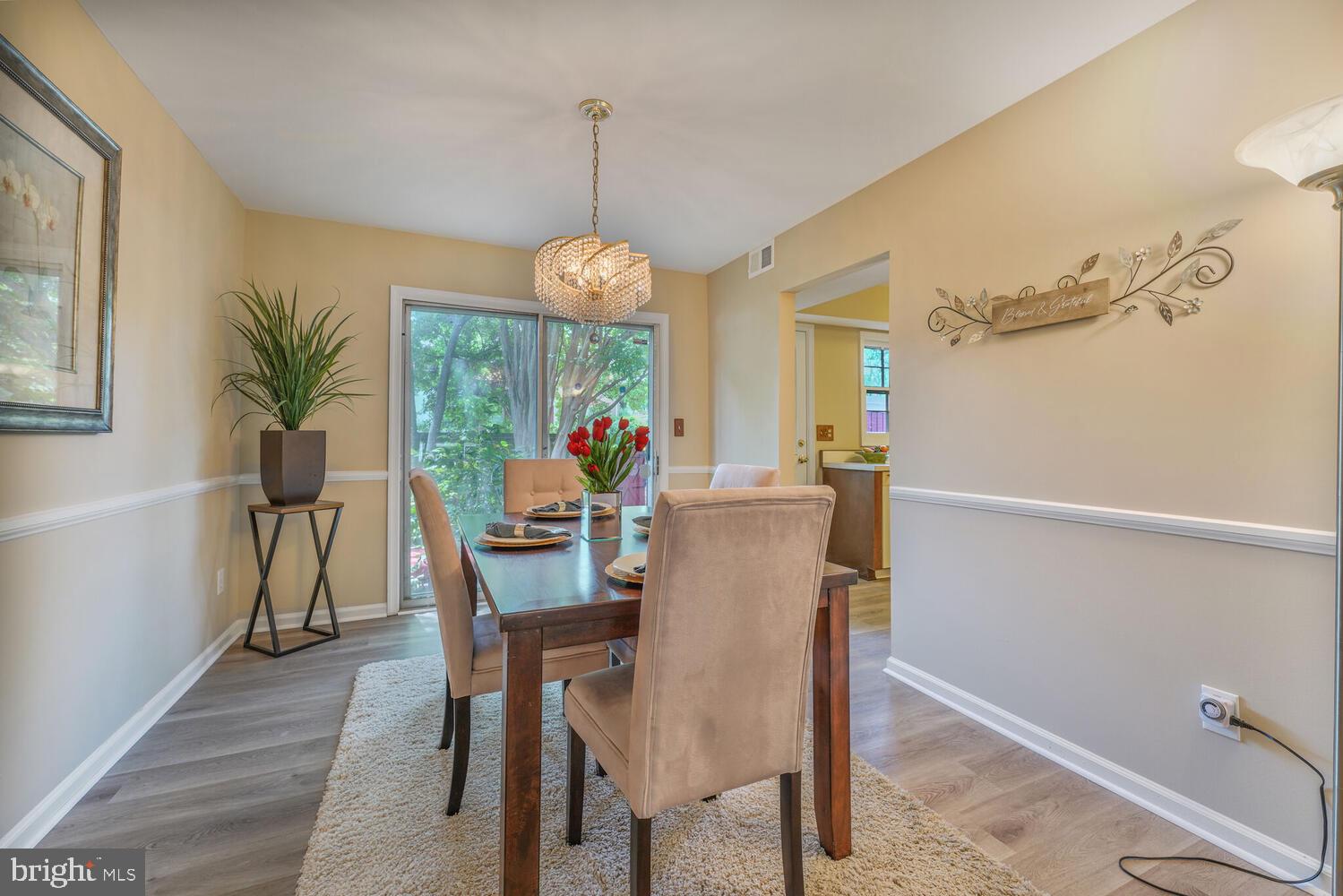 5932 Queenston Street Springfield, VA 22152 - Photo 6 of 47 a view of a dining room with furniture window and wooden floor
