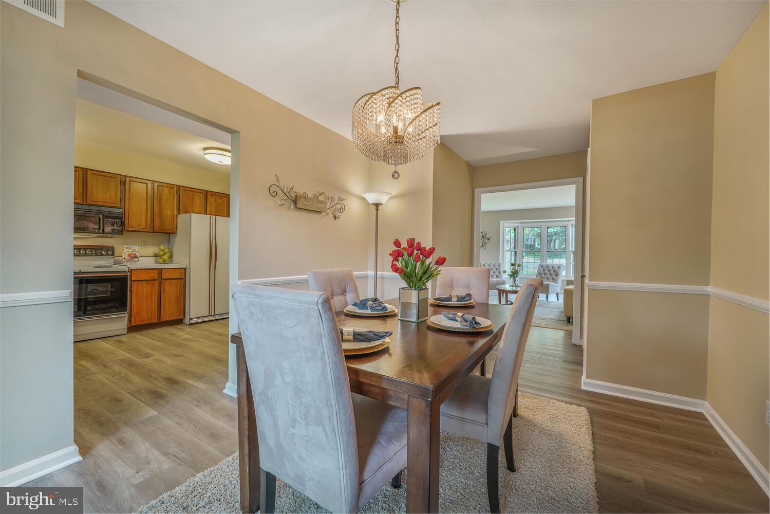 5932 Queenston Street Springfield, VA 22152 - Photo 7 of 47 a view of a dining room with furniture and wooden floor