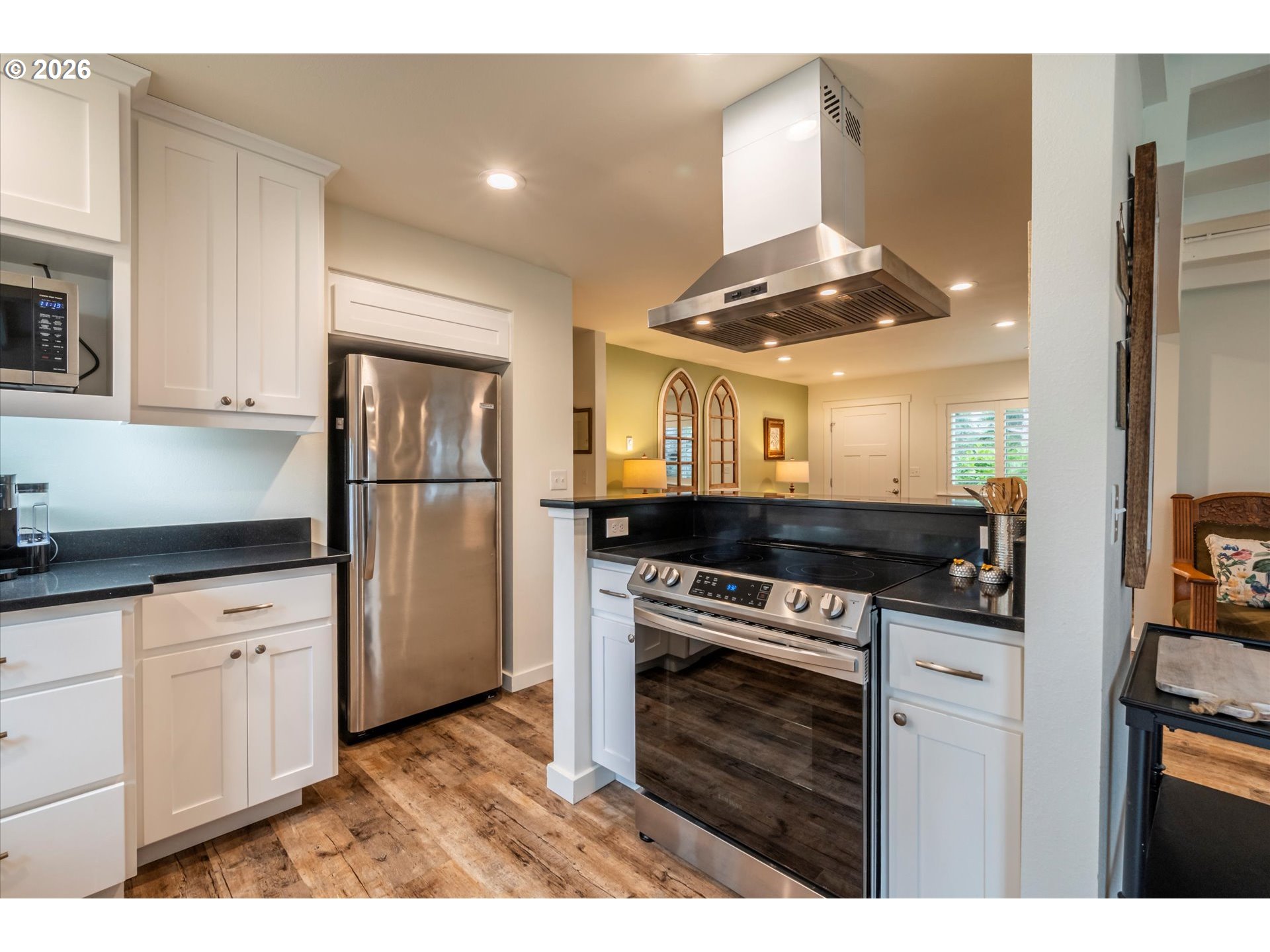 770 9th Street Southeast Bandon, OR 97411 - Photo 13 of 47 a kitchen with a stove and a refrigerator