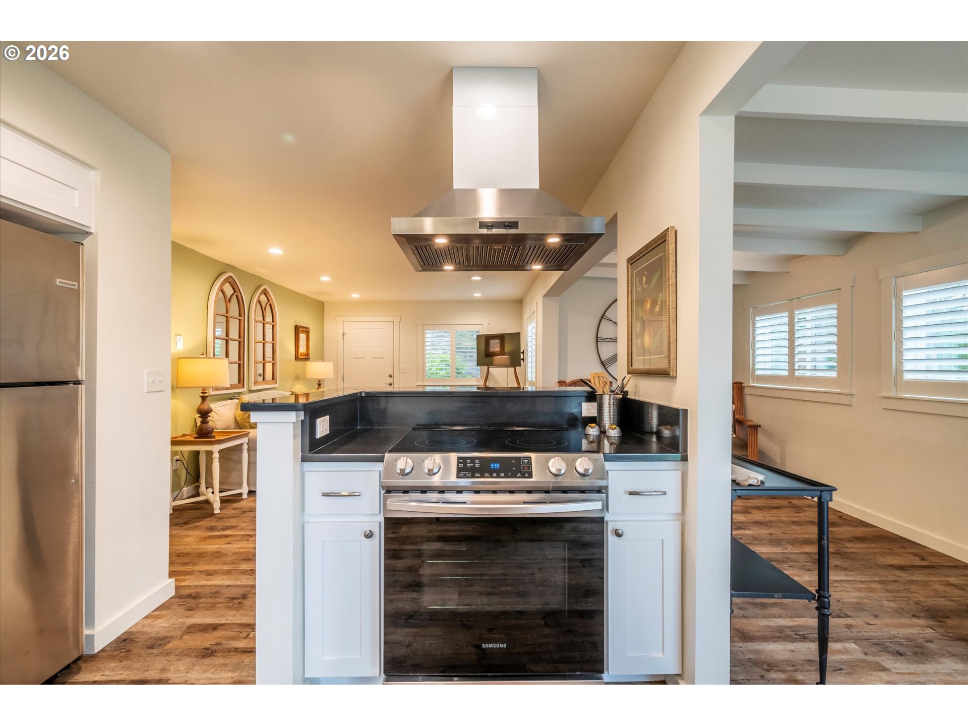 770 9th Street Southeast Bandon, OR 97411 - Photo 17 of 47 a kitchen with a stove and cabinets