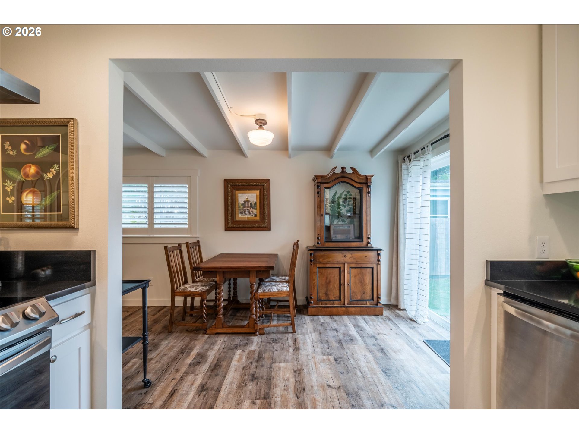 770 9th Street Southeast Bandon, OR 97411 - Photo 20 of 47 a open kitchen with cabinets a refrigerator and a stove top oven