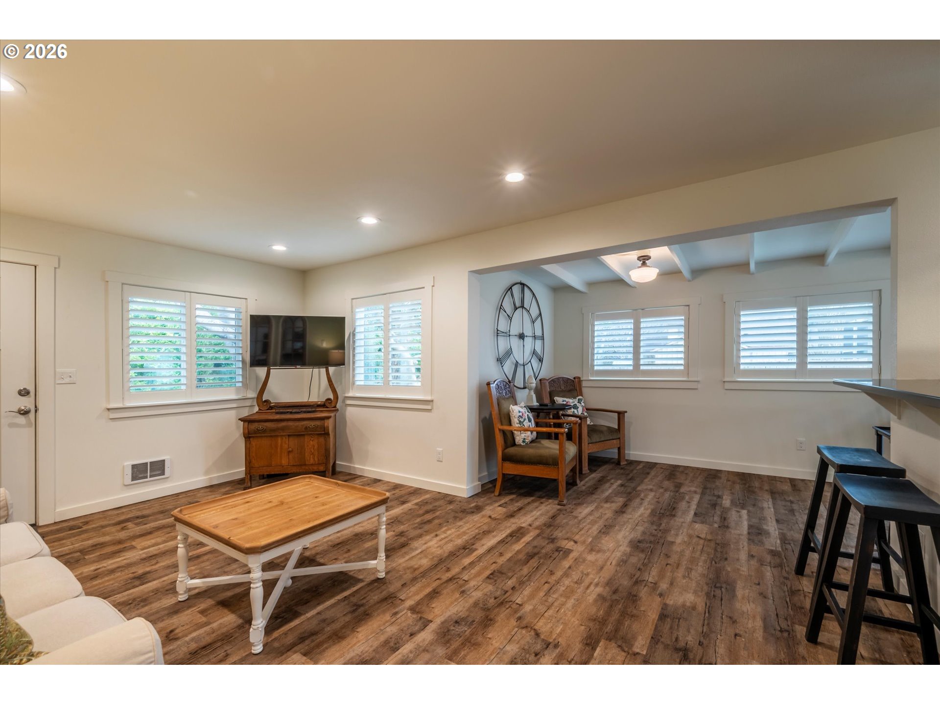 770 9th Street Southeast Bandon, OR 97411 - Photo 25 of 47 a living room with furniture a window and a flat screen tv