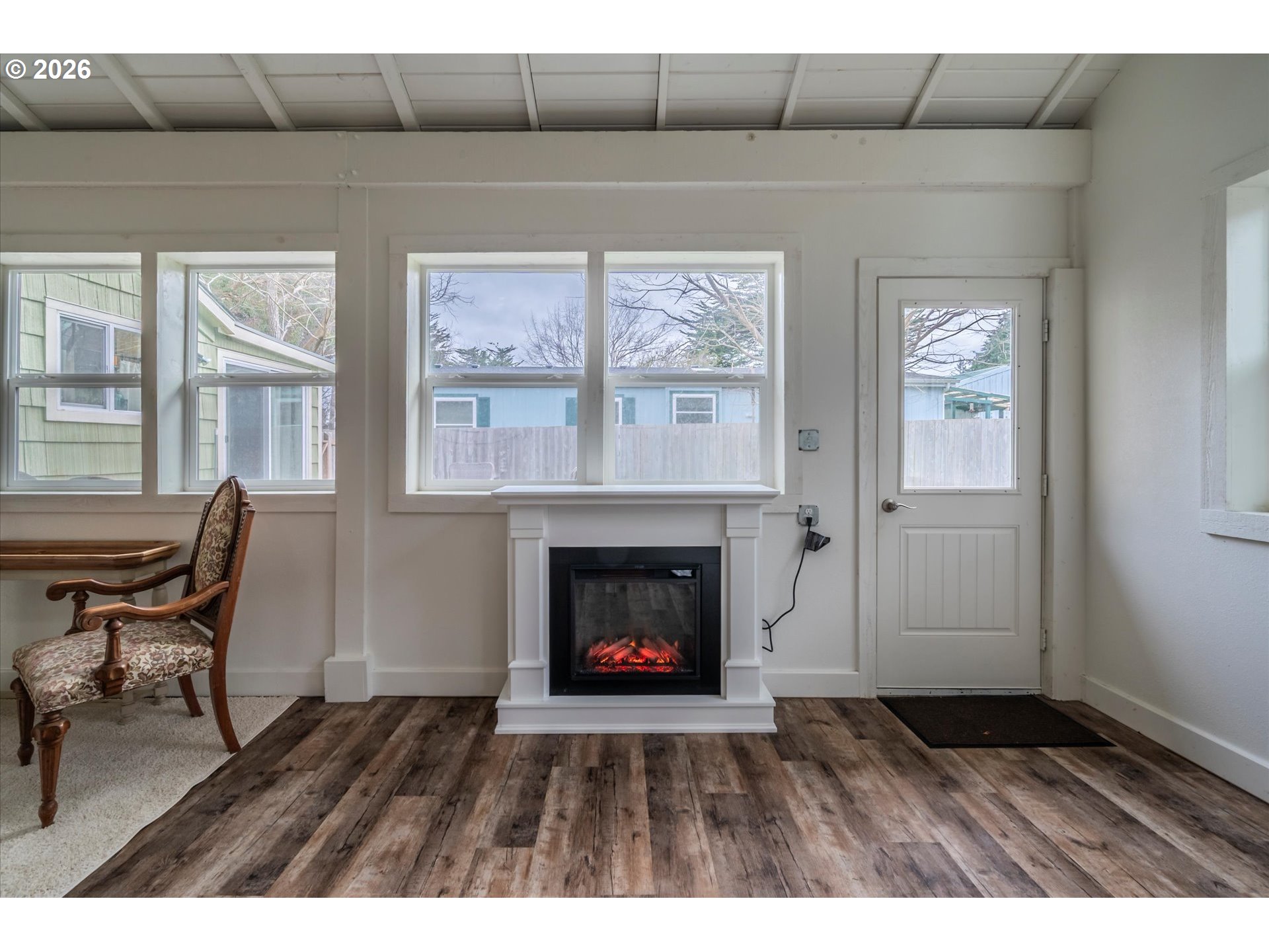 770 9th Street Southeast Bandon, OR 97411 - Photo 31 of 47 a living room with furniture and a fireplace