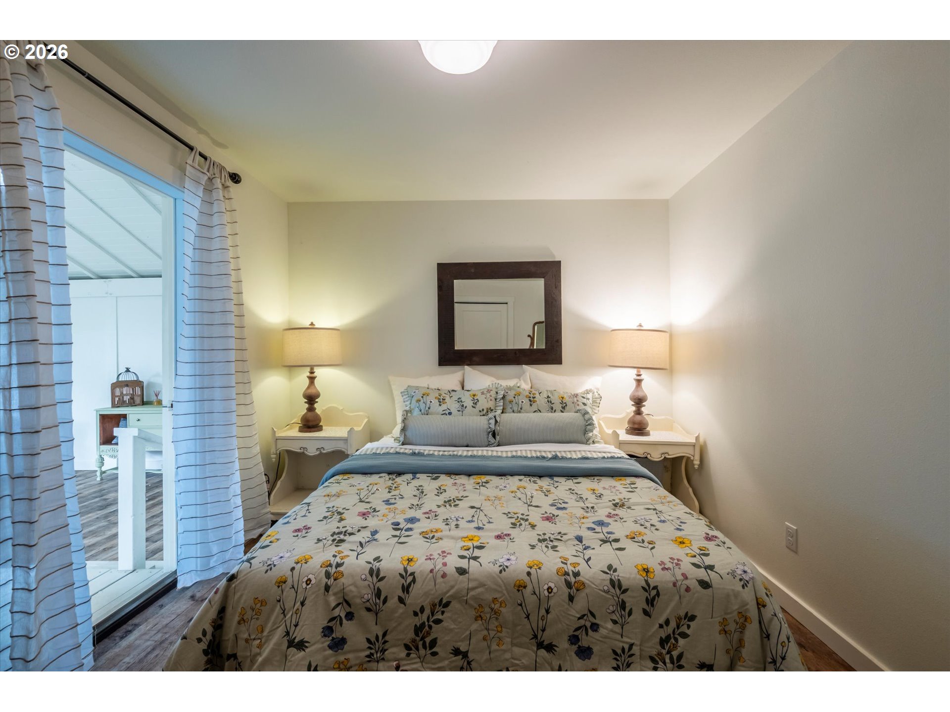 770 9th Street Southeast Bandon, OR 97411 - Photo 35 of 47 a bedroom with a bed and a night stand