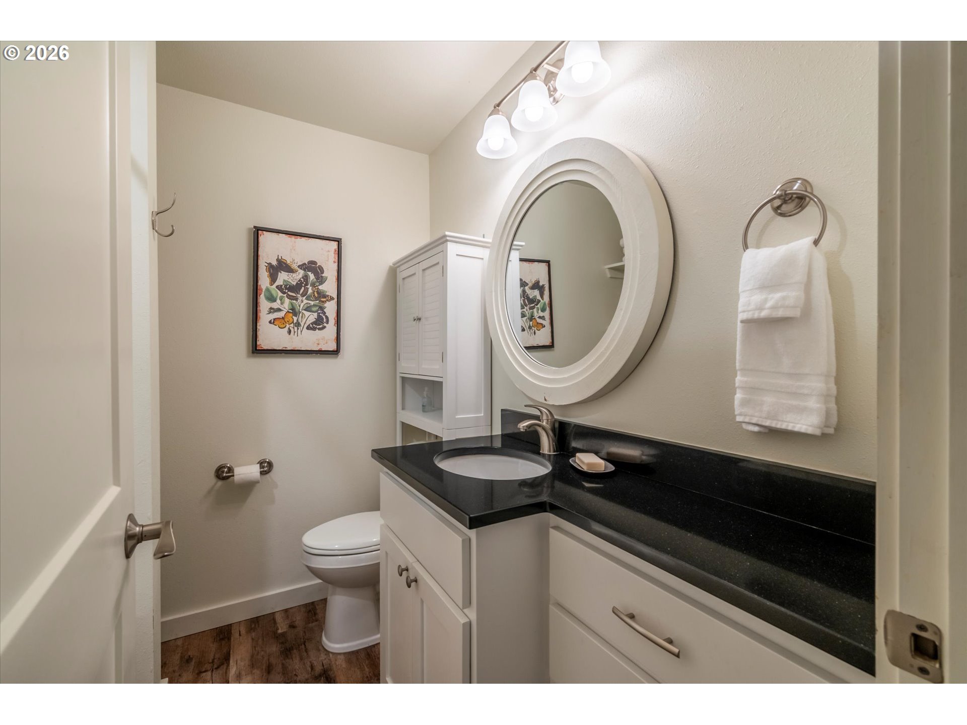 770 9th Street Southeast Bandon, OR 97411 - Photo 37 of 47 a bathroom with a sink a toilet and a mirror