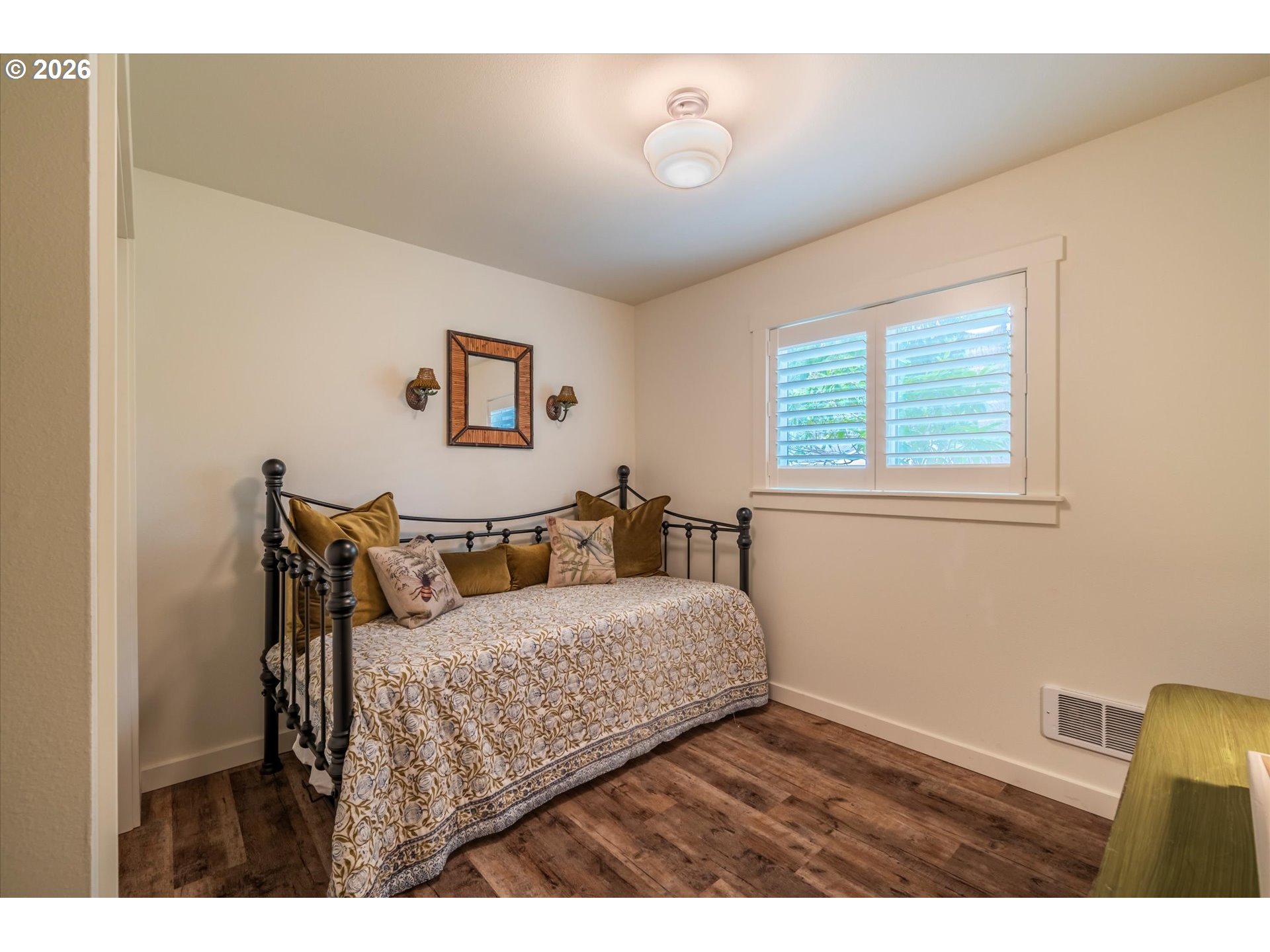 770 9th Street Southeast Bandon, OR 97411 - Photo 38 of 47 a bedroom with a bed and wooden floor