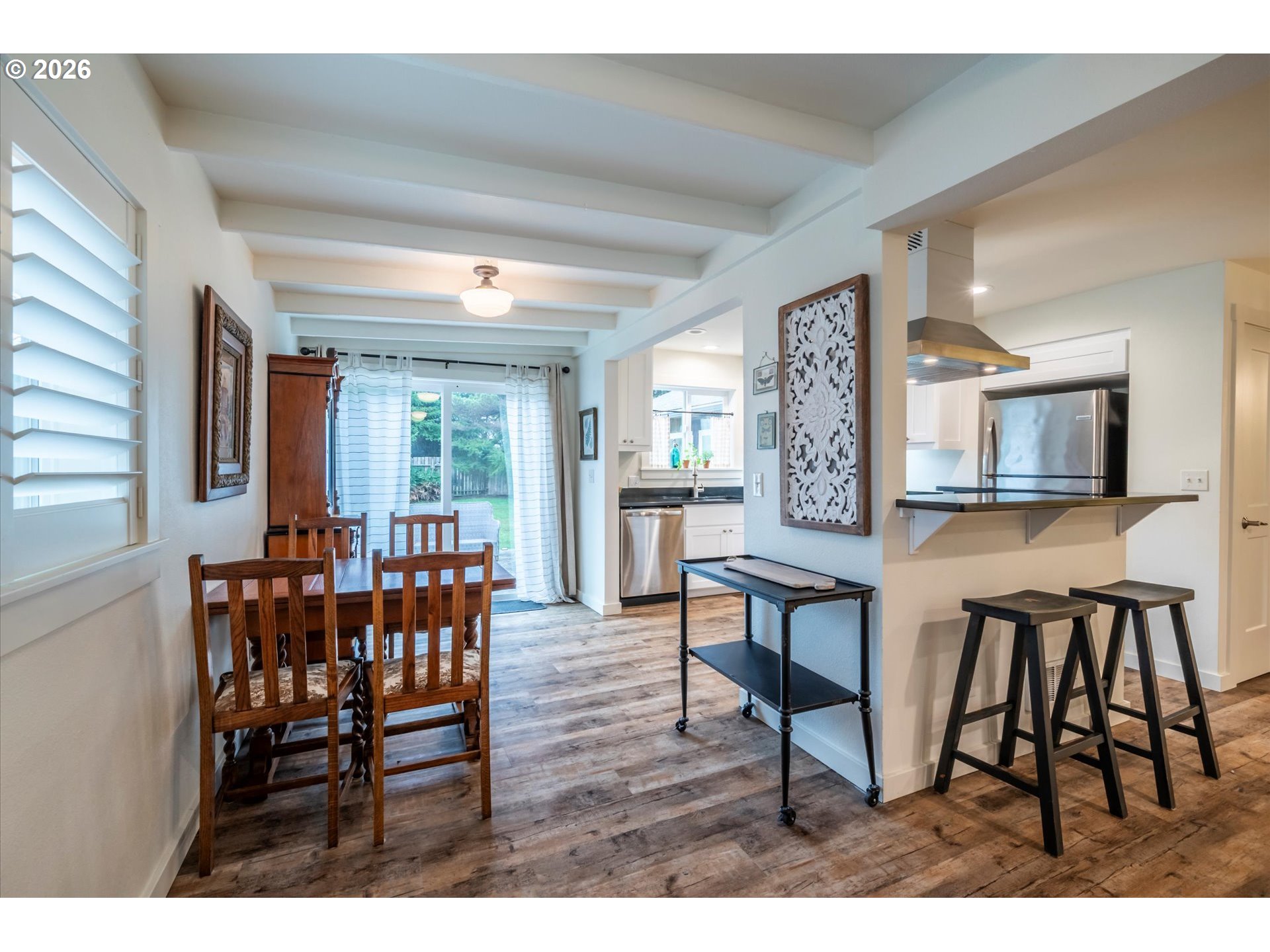 770 9th Street Southeast Bandon, OR 97411 - Photo 45 of 47 a dining room with furniture and window